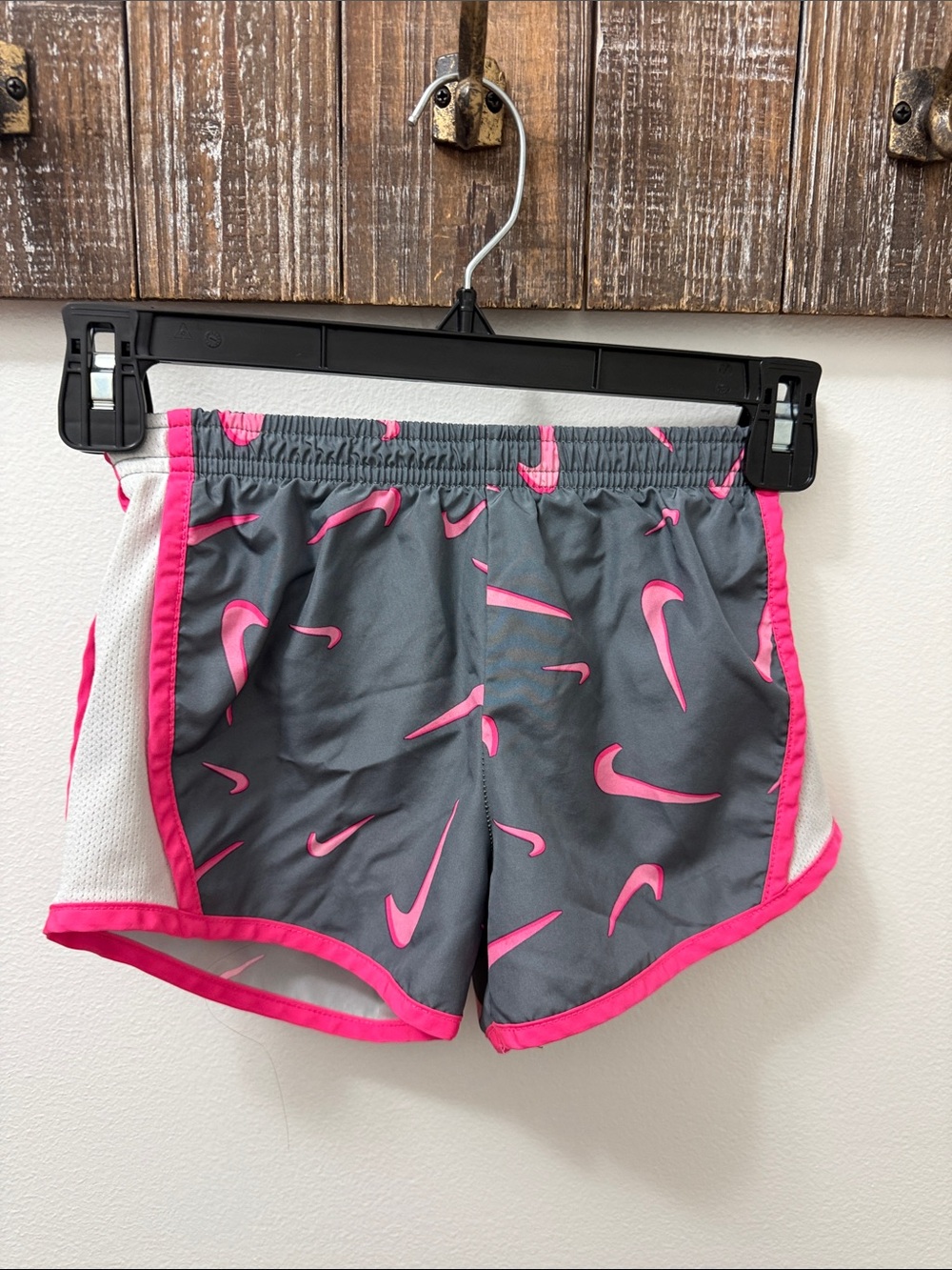 Nike Gray Athletic Shorts with Pink Swoosh Print